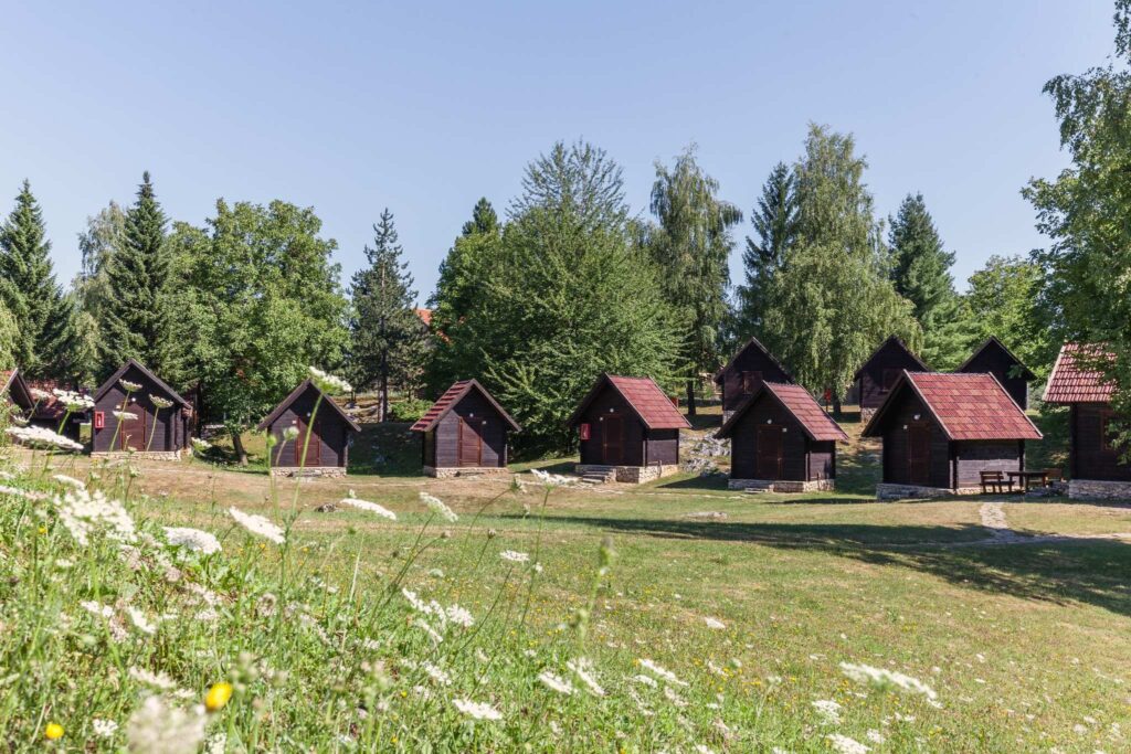 Traditional wooden cabins surrounded by forest at Plitvice Lakes National Park in Croatia